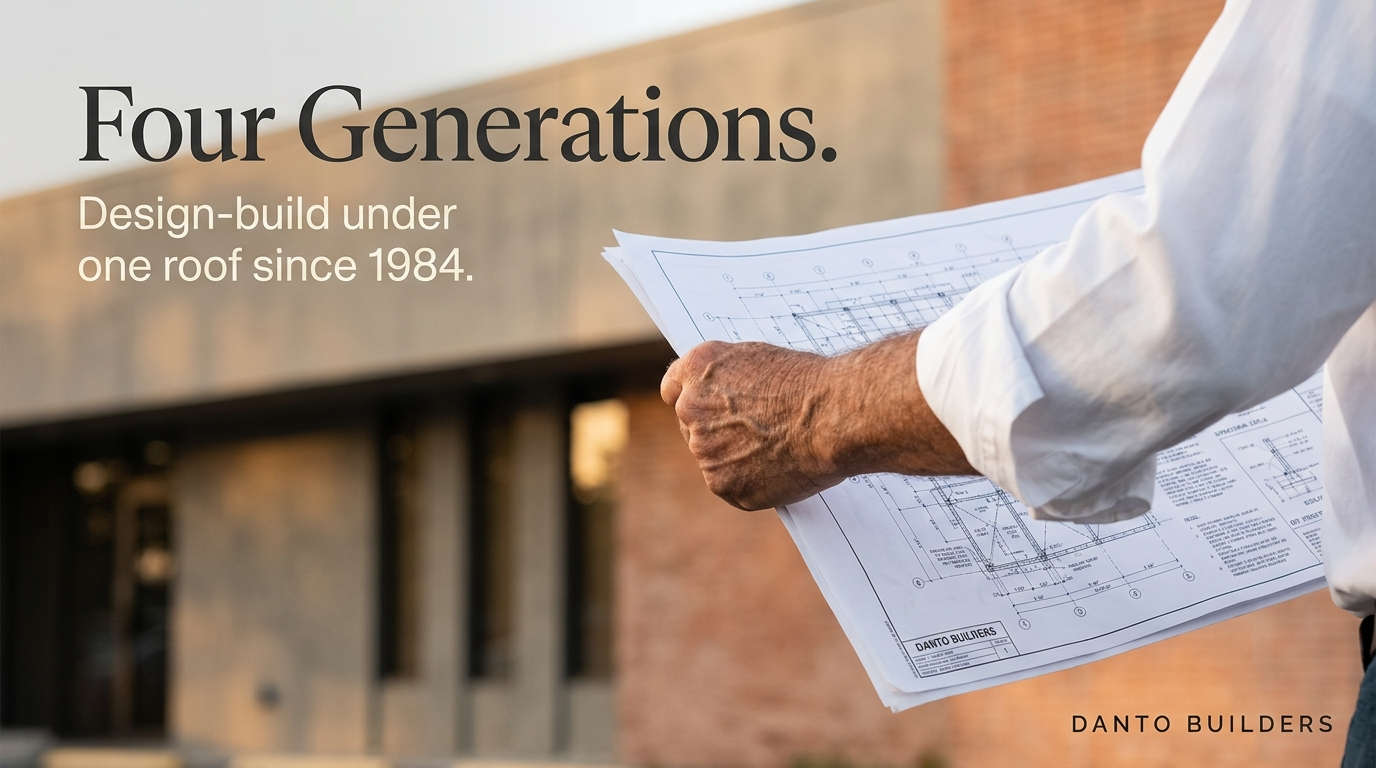 Four Generations brand hero — man holding blueprints, brick building behind